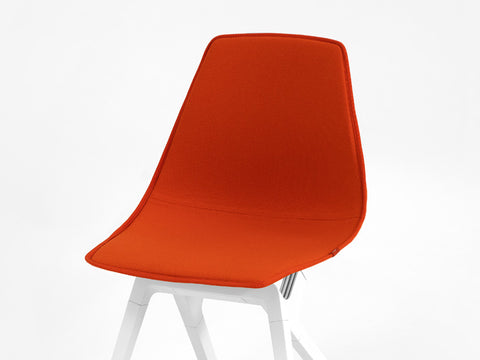 Orange New Zealand Wool topper on a white noho move chair